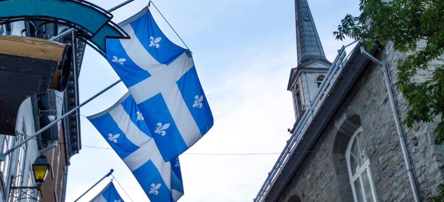 Quebec flags flying in old town Quebec